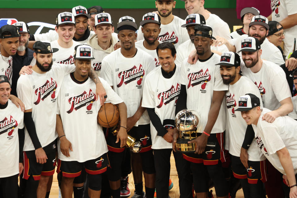 The Miami Heat pose with the Bob Cousy Trophy after defeating the Boston Celtics in the Eastern Conference Finals on May 29, 2023 in Boston.  (Adam Glanzman/Getty Images)