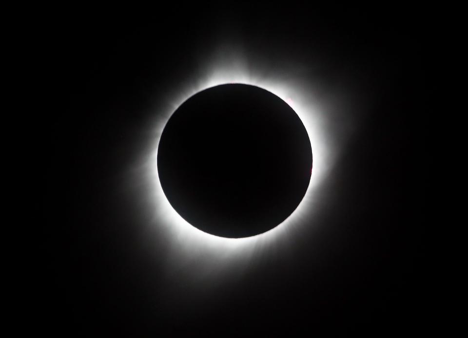 HIAWATHA, KS - AUGUST 21: The sun is seen in full eclipse over a park on August 21, 2017 in Hiawatha, Kansas. Millions of people have flocked to areas of the U.S. that are in the "path of totality" in order to experience a total solar eclipse. (Photo by Jamie Squire/Getty Images)