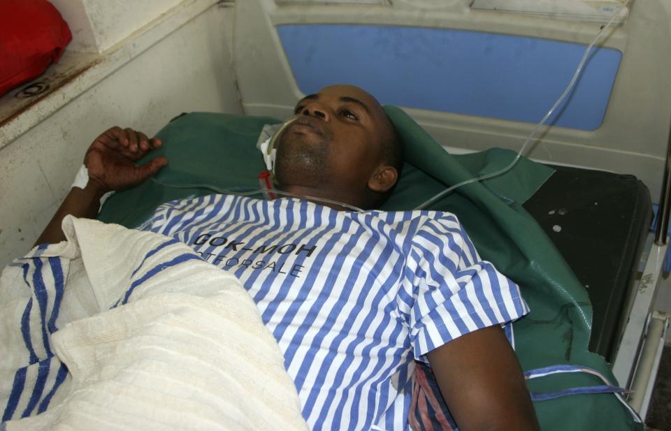 A resident receives treatment at a hospital after he was shot when gunmen attacked Hindi village, near Lamu