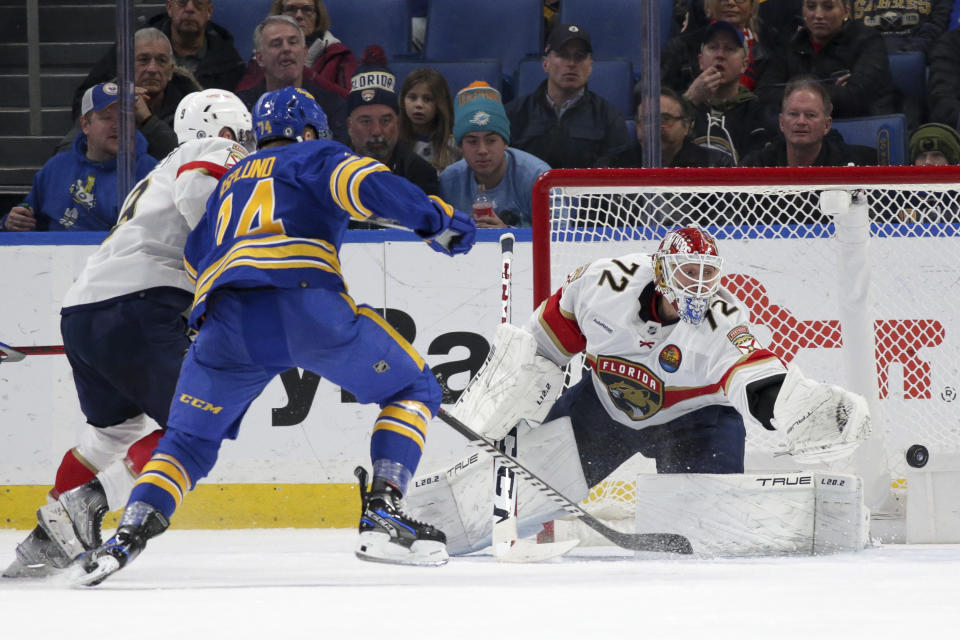 Florida Panthers goaltender Sergei Bobrovsky (72) tracks a shot during the second period of an NHL hockey game against the Buffalo Sabres on Monday, Jan. 16, 2023, in Buffalo, N.Y. (AP Photo/Joshua Bessex)