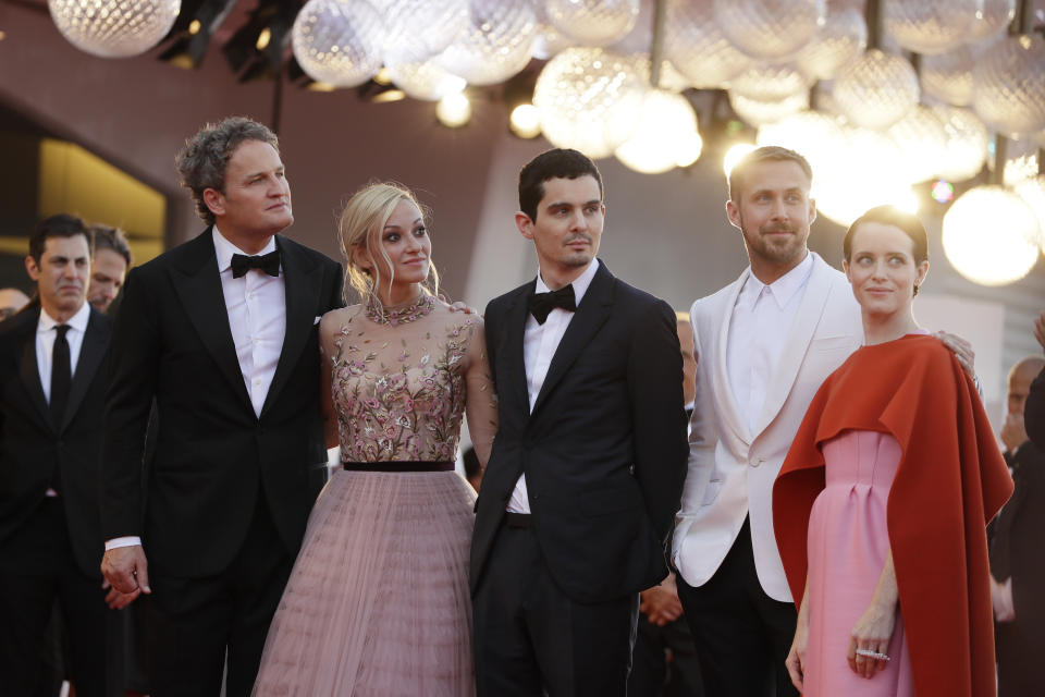 Actors Jason Clarke, from left, Olivia Hamilton, director Damien Chazelle, actors Ryan Gosling and Claire Foy pose for photographers upon arrival at the premiere of the film 'First Man' and the opening ceremony of the 75th edition of the Venice Film Festival in Venice, Italy, Wednesday, Aug. 29, 2018. (AP Photo/Kirsty Wigglesworth)