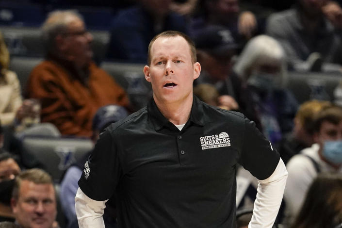 Xavier coach Travis Steele stands near the bench during the first half of an NCAA college basketball game against Providence, Wednesday, Jan. 26, 2022, in Cincinnati. (AP Photo/Jeff Dean)