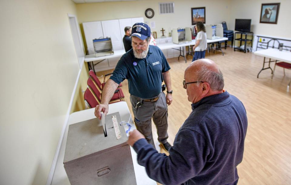 First to vote, Ed Shiffer, left, near Poll Clerk John Elsea during the Anderson city election at Anderson 6/1 precinct at Trinity United Methodist Church in Anderson, S.C. Monday, April 2, 2024.