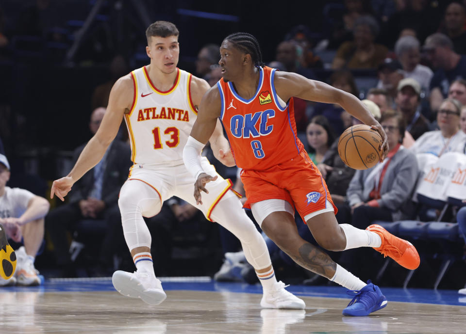 Nov 6, 2023; Oklahoma City, Oklahoma, USA; Oklahoma City Thunder forward Jalen Williams (8) drives against Atlanta Hawks guard Bogdan Bogdanovic (13) during the second quarter at Paycom Center. Mandatory Credit: Alonzo Adams-USA TODAY Sports