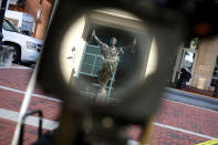 <p>The statue of Justice outside the Albert V. Bryan U.S. Courthouse is reflected in a television news camera lens on the second day of former Trump campaign chairman Paul Manafort’s trial August 1, 2018 in Alexandria, Va. (Photo: Chip Somodevilla/Getty Images) </p>