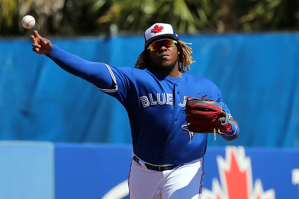 Dunedin, FL - MAR 03:  Vladimir Guerrero Jr. (27) of the Blue Jays makes the throw over to first base during the spring training game between the Philadelphia Phillies and the Toronto Blue Jays on March 06, 2019, at the Dunedin Stadium in Dunedin, FL. (Photo by Cliff Welch/Icon Sportswire via Getty Images)