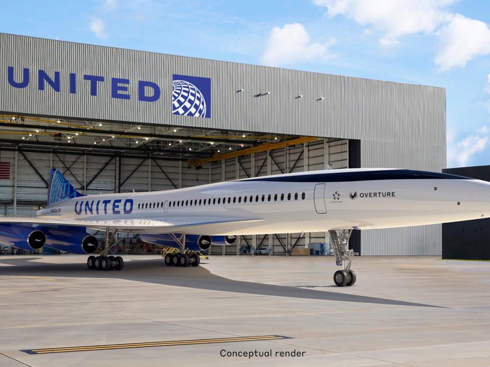 Boom Supersonic's Overture with United's branding in front of a United building.