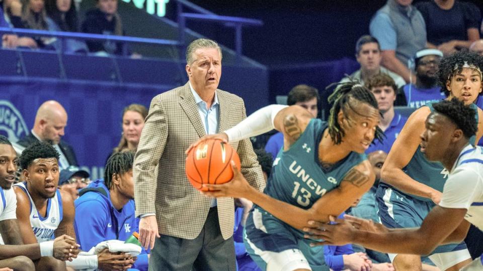 A concerned-looking John Calipari watches as Adou Thiero guards UNC Wilmington’s Trazarien White during Saturday’s game in Rupp Arena.