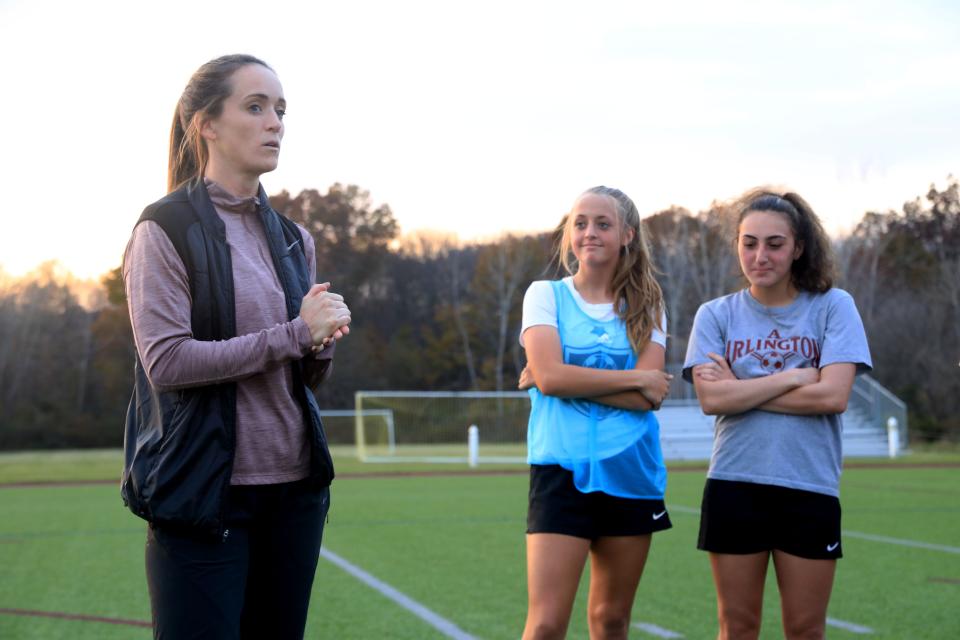 Arlington girls soccer head coach Kelley Hand-Hunt talks to her team after practice on Nov. 9, 2021.