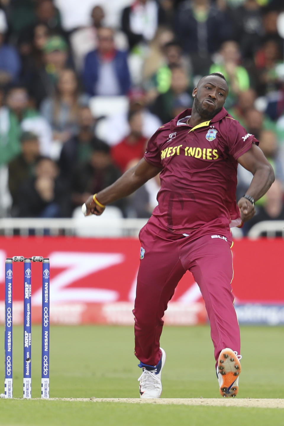 West Indies' Andre Russell bowls against Pakistan during a Cricket World Cup match at Trent Bridge cricket ground in Nottingham, England, Friday, May 31, 2019. (AP Photo/Rui Vieira)