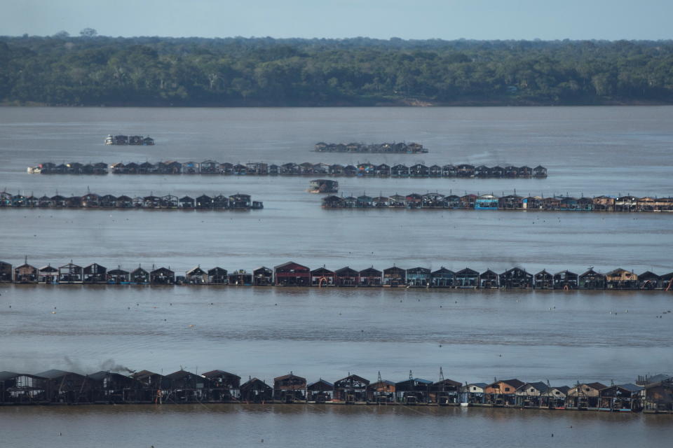 An aerial view shows hundreds of dredging rafts operated by illegal miners who have gathered in a gold rush on the Madeira, a major tributary of the Amazon river, in Autazes, Amazonas state, Brazil November 23, 2021. Picture taken November 23, 2021. REUTERS/Bruno Kelly