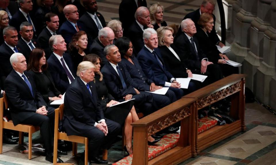 Donald Trump sits with first lady Melania Trump, former President Barack Obama, former first lady Michelle Obama, former President Bill Clinton and former first lady Hillary Clinton, former President Jimmy Carter and first lady Rosalynn Carter in the front row at the state funeral for former President George HW.Bush at the National Cathedral.