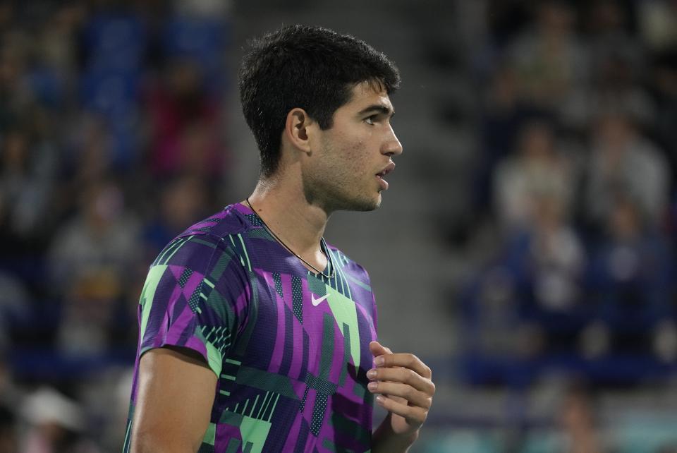 Carlos Alcaraz of Spain reacts after missing a ball against Andrey Rublev of Russia, during a semi-final match of the Mubadala World Tennis Championship, in Abu Dhabi, United Arab Emirates, Saturday, Dec. 17, 2022. (AP Photo/Kamran Jebreili)