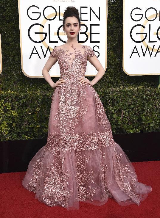 Lily Collins arrives at the 74th annual Golden Globe Awards at the Beverly Hilton Hotel on Sunday, Jan. 8, 2017, in Beverly Hills, Calif. (Photo by Jordan Strauss/Invision/AP)