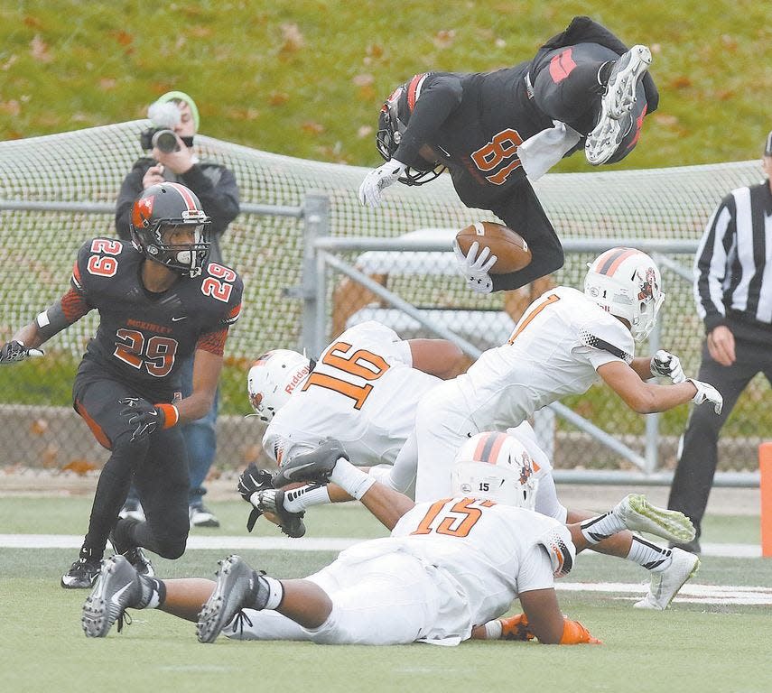 McKinley quarterback Dominique Robinson flips into the end zone for the winning touchdown against Massillon in the closing seconds of the fourth quarter, Oct. 31, 2015, at Fawcett Stadium.