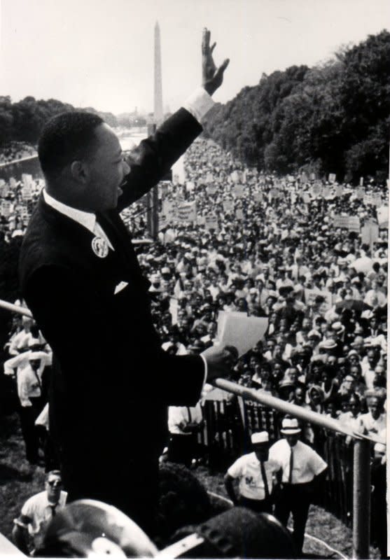 The Rev. Martin Luther King Jr. waves to the assembled crowd during the March on Washington August 28, 1963. UPI File Photo