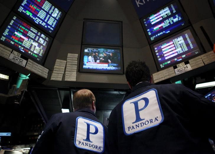 Traders work at the kiosk where Pandora internet radio is traded on the floor of the New York Stock Exchange, in this June 15, 2011 file photo.   REUTERS/Brendan McDermid/Files 