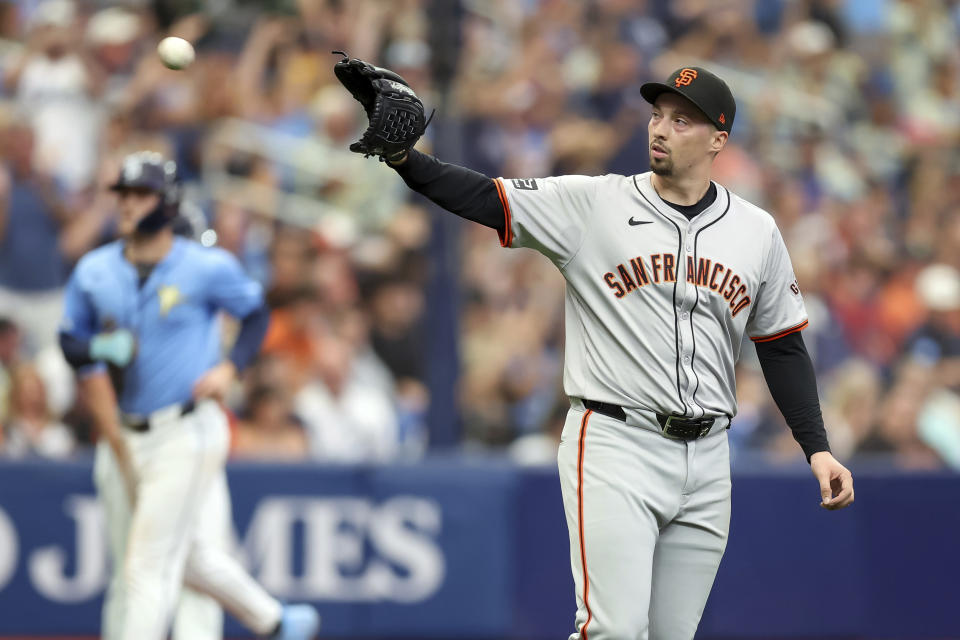 San Francisco Giants starting pitcher Blake Snell waits for a new ball after giving up a three-run home run to Tampa Bay Rays' Rene Pinto during the fourth inning of a baseball game Sunday, April 14, 2024, in St. Petersburg, Fla. (AP Photo/Mike Carlson)