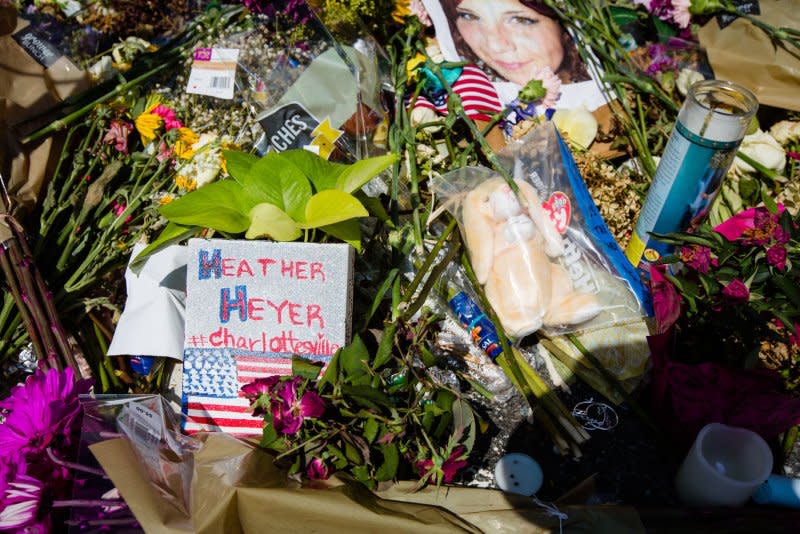 Thousands of flowers and messages cover the street in a makeshift memorial at the site where Heather Heyer was killed August 13, 2017, when a car hit a group of people protesting against a rally of white supremacists in Charlottesville, Va. File Photo by Erin Schaff/UPI