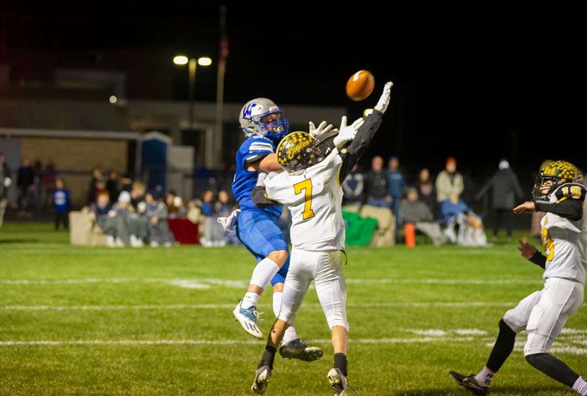 Wynford's Kohan Keith hauls in a deep pass over Colonel Crawford's Lucas Foy.