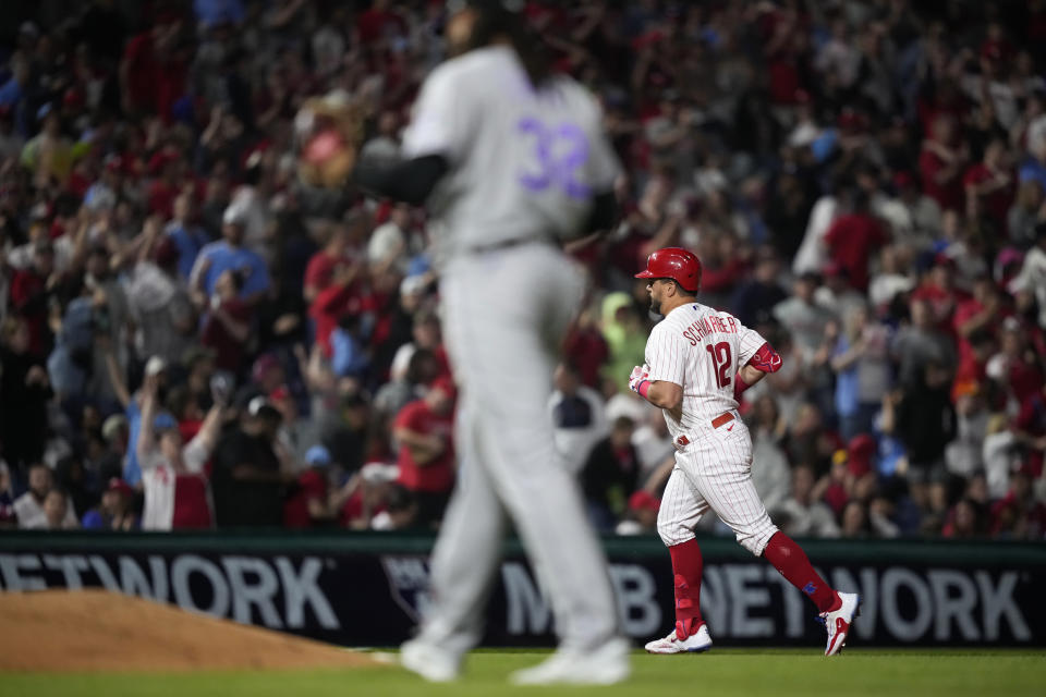 Philadelphia Phillies' Kyle Schwarber rounds the bases after hitting a home run against Colorado Rockies relief pitcher Dinelson Lamet during the seventh inning of a baseball game, Friday, April 21, 2023, in Philadelphia. (AP Photo/Matt Slocum)