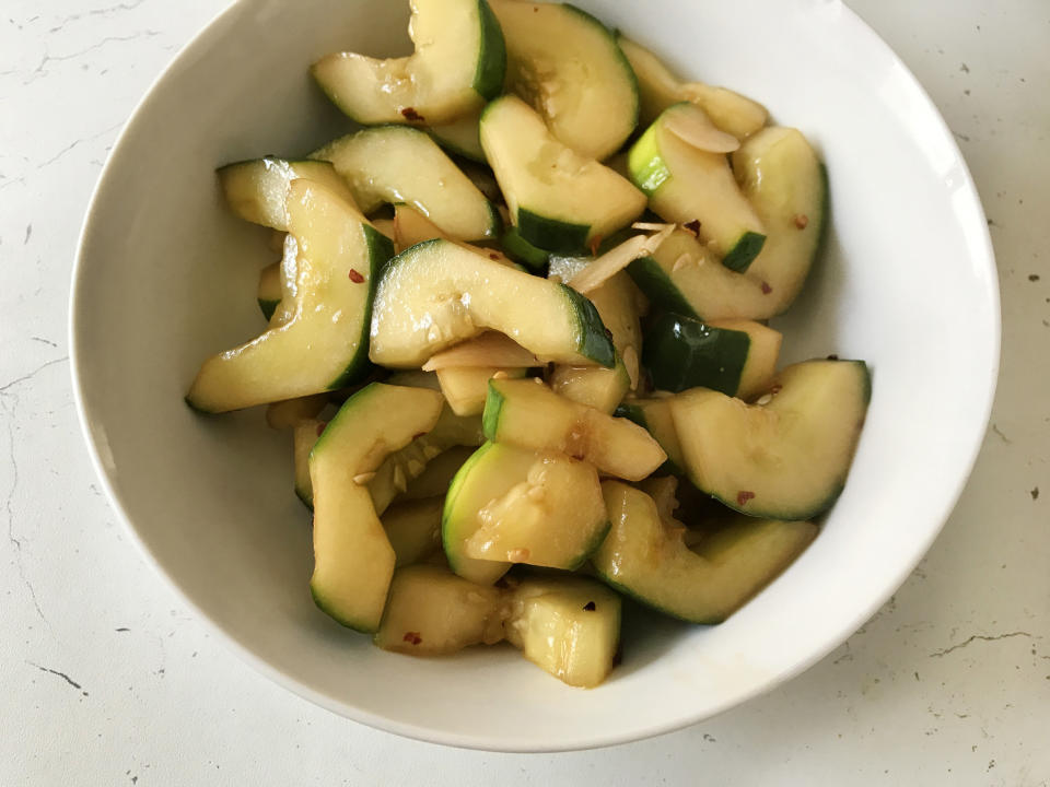 A bowl of piping-hot cucumber saut&eacute;ed in soy sauce, garlic and chili flakes. We promise it tastes way better than it sounds. (Photo: Julie R Thomson)