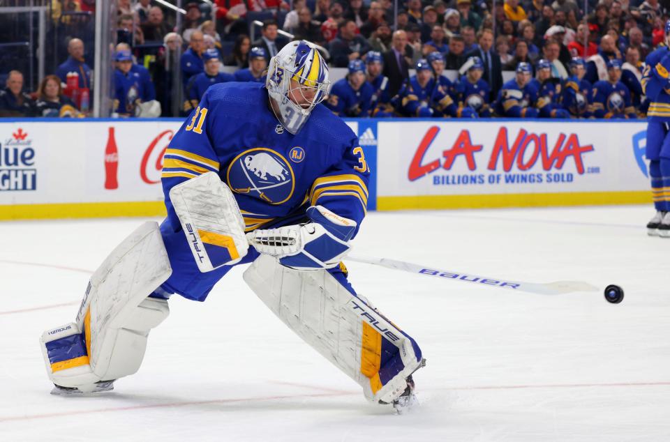 Buffalo Sabres goaltender Eric Comrie clears the puck during the first period against the Detroit Red Wings at KeyBank Center in Buffalo on Dec. 5, 2023.