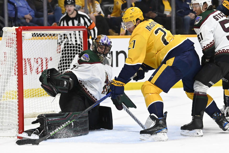 Arizona Coyotes goaltender Karel Vejmelka blocks a shot by Nashville Predators defenseman Ryan McDonagh during the second period of an NHL hockey game, Monday, Feb.13, 2023, in Nashville, Tenn. (AP Photo/Mark Zaleski)