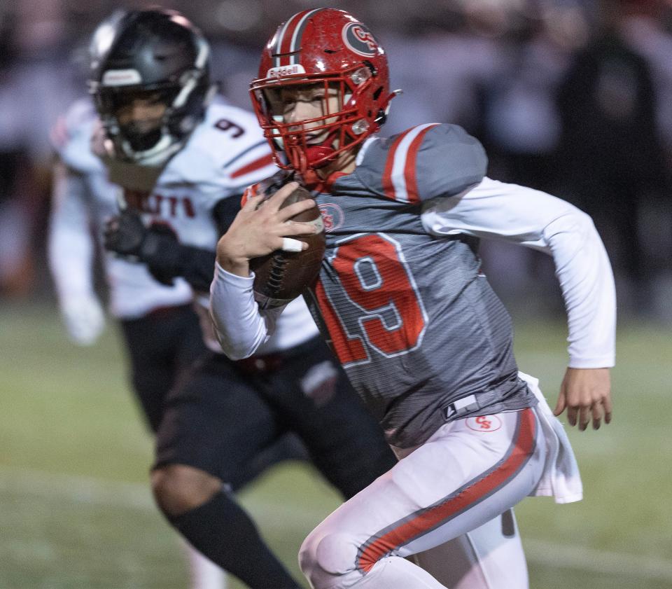 Canton South quarterback Poochie Snyder runs with the ball in a home playoff game vs. Buchtel, Friday, Nov. 3, 2023.