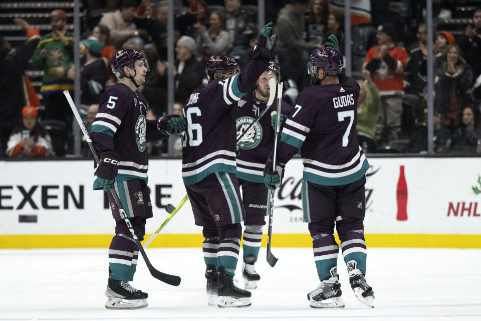 Anaheim Ducks defenseman Radko Gudas (7) celebrates after his goal with center Ryan Strome (16) during the second period of an NHL hockey game against the Los Angeles Kings, Friday, Nov. 24, 2023, in Anaheim, Calif. (AP Photo/Kyusung Gong)