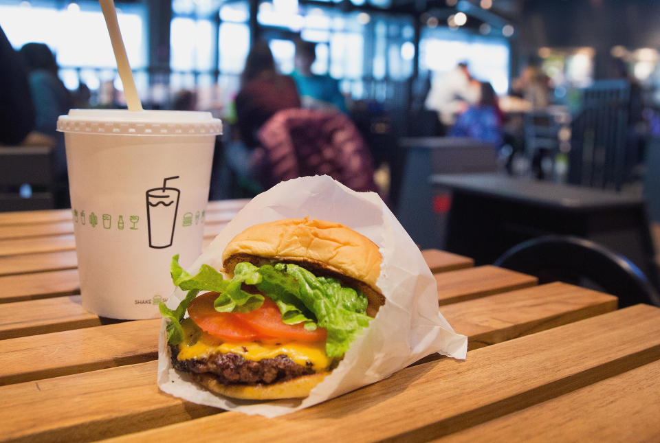 CHICAGO, IL - JANUARY 28:  In this photo illustration a cheeseburger and drink is served up at a Shake Shack restaurant on January 28, 2015 in Chicago, Illinois. The burger chain, with currently has 63 locations, is expected to go public this week with an IPO priced between $17 to $19 a share. The company will trade on the New York Stock Exchange under the ticker symbol SHAK.  (Photo Illustration by Scott Olson/Getty Images)