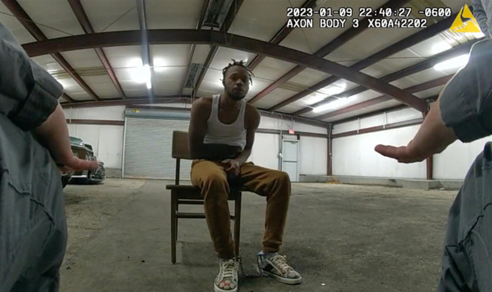 In this image from Baton Rouge Police Department body camera video, officers interact with Jeremy Lee inside a warehouse in Baton Rouge on Jan. 9, 2023. Lee sued the department in August 2023 alleging officers abused him in the police warehouse nicknamed the “Brave Cave.” (Baton Rouge Police Department via AP)