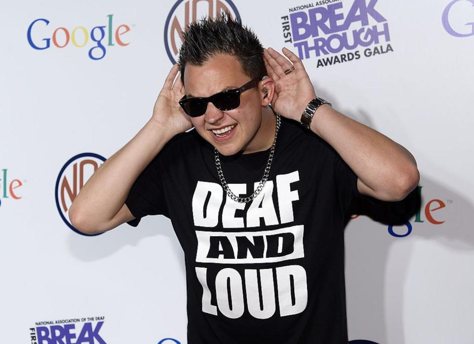 Sean Forbes poses during the 2014 National Association for the Deaf Breakthrough Awards Gala. <a href="https://www.gettyimages.com/detail/news-photo/deaf-rapper-sean-forbes-poses-during-the-national-news-photo/478567403?adppopup=true" rel="nofollow noopener" target="_blank" data-ylk="slk:Kevork Djansezian/Getty Images;elm:context_link;itc:0;sec:content-canvas" class="link ">Kevork Djansezian/Getty Images</a>