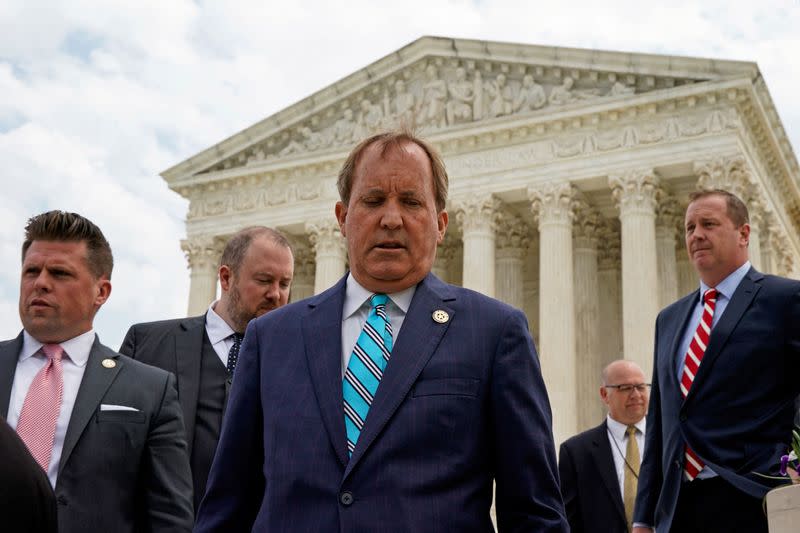 FILE PHOTO: Texas Attorney General Ken Paxton leaves a news conference in Washington