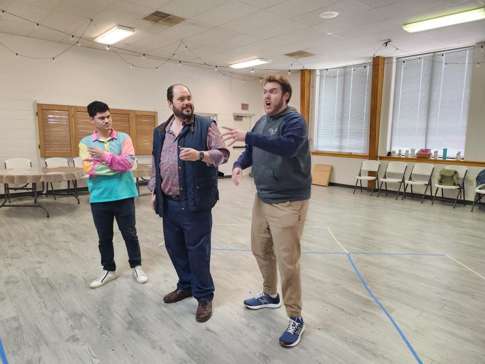 Amarillo Opera cast members, from left, Nicholas Flott as Borsa, Eric Barry as the Duke of Montua, and Chancelor Barbaree as Marullo, rehearse for Verdi's "Rigoletto." The production will be held April 1 in the Globe-News Center for the Performing Arts.