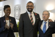 Britain's Foreign Secretary James Cleverly, centre, poses with Rwandan Minister of Innovation, Paula Ingabire, left, and Canadian Minister of Innovation Francis-Philippe Champagne during the AI Safety Summit at Bletchley Park in Milton Keynes, England, Thursday, Nov. 2, 2023. Political leaders, digital officials, tech company bosses and researchers are converging two days at a former codebreaking spy base near London to discuss and better understand the extreme risks posed by cutting-edge artificial intelligence. (AP Photo/Alastair Grant)