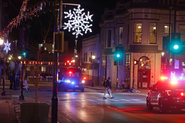 Police canvass the streets in downtown Waukesha, Wisconsin, after a vehicle plowed into a Christmas parade on Sunday.  (Photo: AP Photo/Jeffrey Phelps)