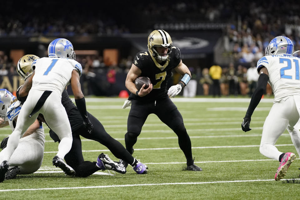 New Orleans Saints quarterback Taysom Hill runs during the second half of an NFL football game against the Detroit Lions, Sunday, Dec. 3, 2023, in New Orleans. (AP Photo/Gerald Herbert)