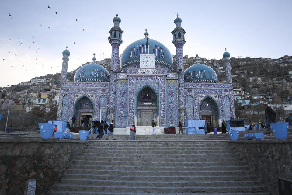 Afghans walk outside Hazara's Sakhi Shrine in Kabul, Afghanistan, Friday, April 19, 2024. (AP Photo/Siddiqullah Alizai)