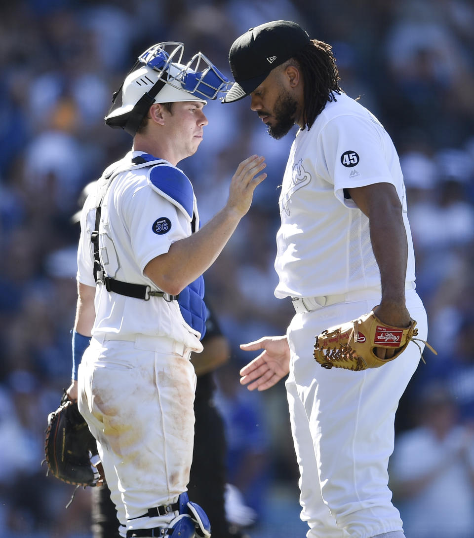 Los Angeles Dodgers relief pitcher Kenley Jansen, right, celebrates with catcher Will Smith after the team's baseball game against the New York Yankees in Los Angeles, Saturday, Aug. 24, 2019. The Dodgers won 2-1. (AP Photo/Kelvin Kuo)