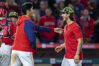 Los Angeles Angels' Shohei Ohtani, left, congratulates relief pitcher Michael Lorenzen after the Angels defeated the Oakland Athletics 5-3 in a baseball game in Anaheim, Calif., Saturday, May 21, 2022. (AP Photo/Alex Gallardo)