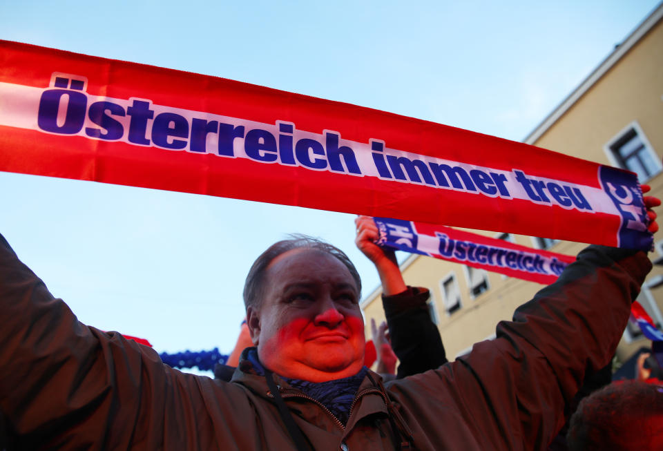 A supporter holds a banner reading "Austria always loyal" during the Austrian Freedom Party's final election campaign rally in Vienna. (Photo: Michael Dalder / Reuters)