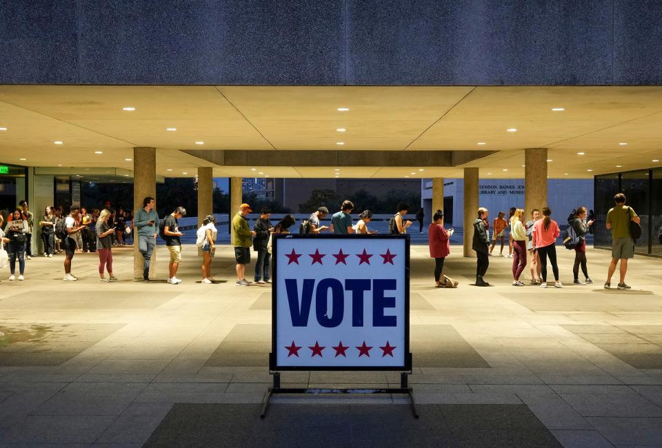 Voters wait in line in Austin, Texas, on Nov. 8, 2022.