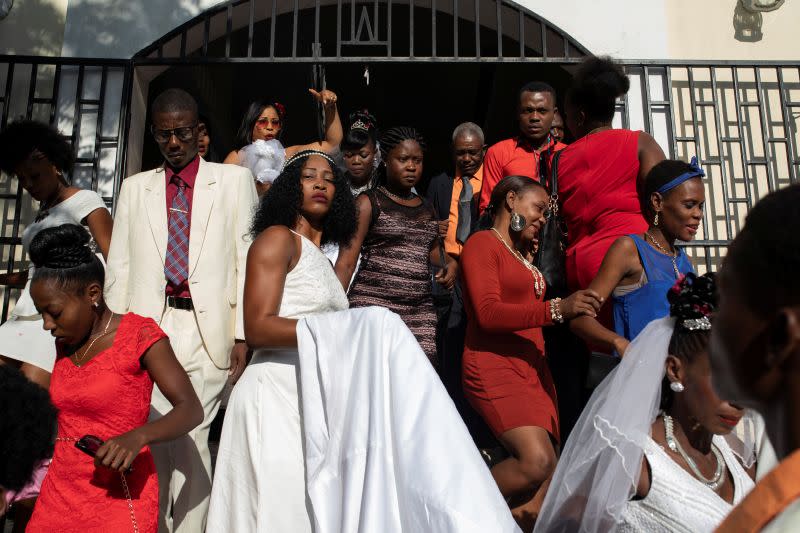 The Wider Image: Haiti's brides beat hurricanes, power cuts and protests to wed in style