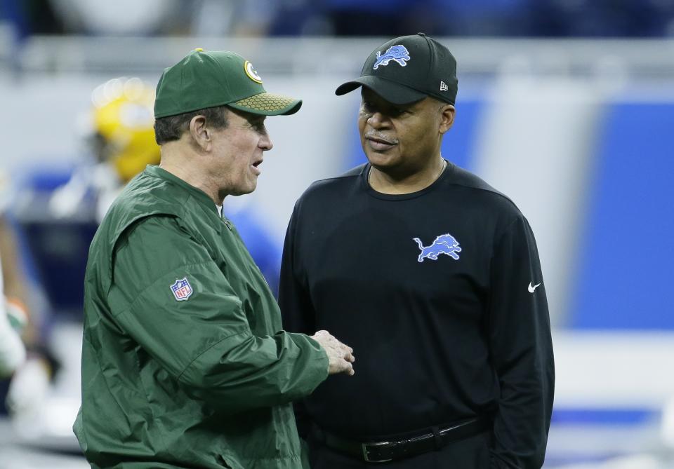 Packers defensive coordinator Dom Capers, left, talks with Lions coach Jim Caldwell before a Week 17 game. Both men were fired after the game. (AP)