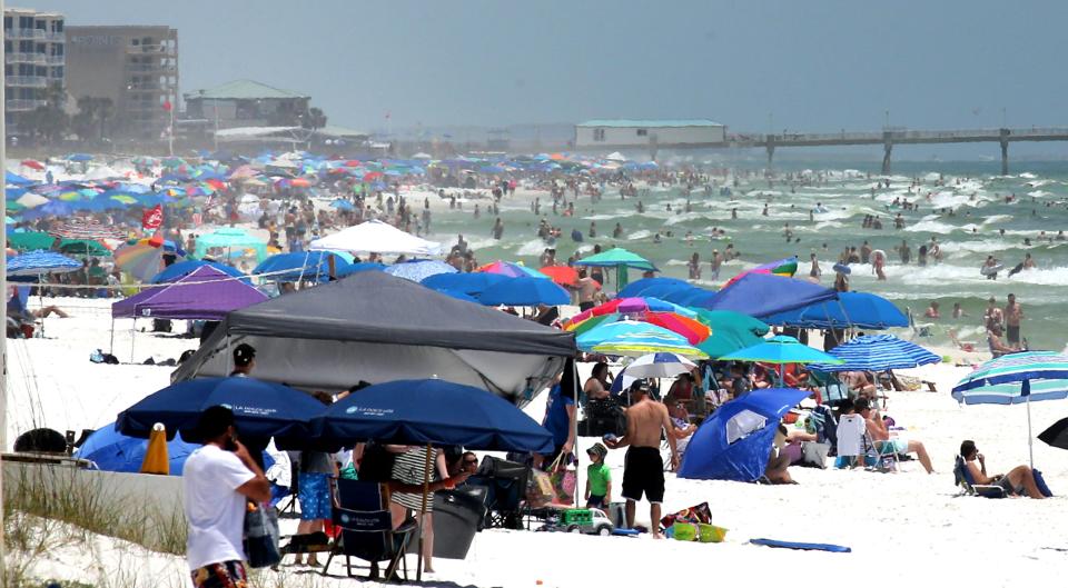 People pack the beaches on Okaloosa Island, Florida, as the long Memorial Day weekend begins.