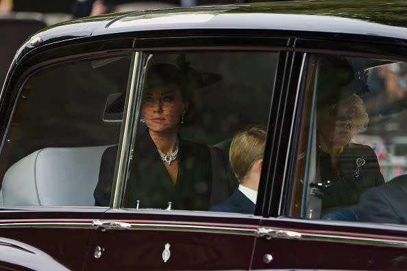 LONDON, ENGLAND - SEPTEMBER 19: Catherine, Princess of Wales, Camilla, Queen Consort and Prince George of Wales are seen on The Mall ahead of The State Funeral for Queen Elizabeth II on September 19, 2022 in London, England. Elizabeth Alexandra Mary Windsor was born in Bruton Street, Mayfair, London on 21 April 1926. She married Prince Philip in 1947 and ascended the throne of the United Kingdom and Commonwealth on 6 February 1952 after the death of her Father, King George VI. Queen Elizabeth II died at Balmoral Castle in Scotland on September 8, 2022, and is succeeded by her eldest son, King Charles III.  (Photo by Joe Maher/Getty Images)