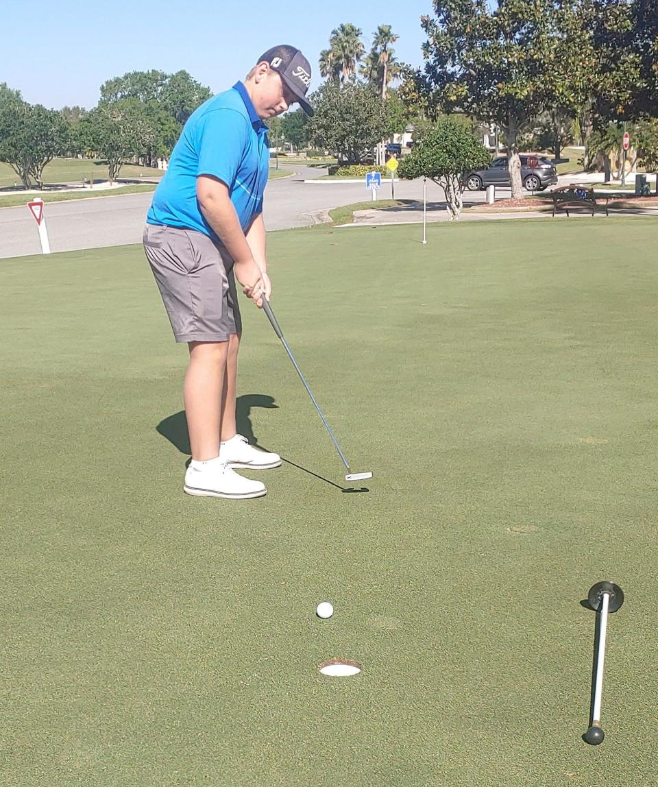 Carson Perry honing his putting stroke ahead of Sunday's Drive, Chip and Putt competition at Augusta National.