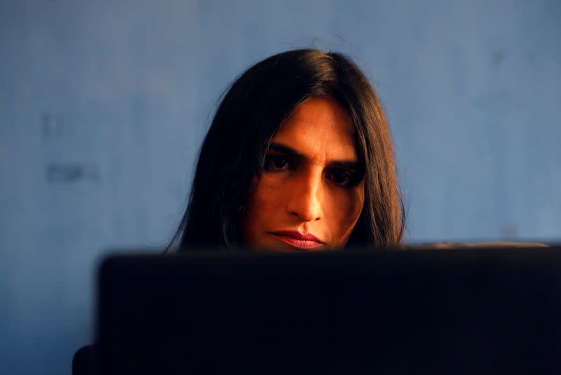 Nisha Rao, 28, a transgender woman who became country's first practicing lawyer, works at her office in Karachi,