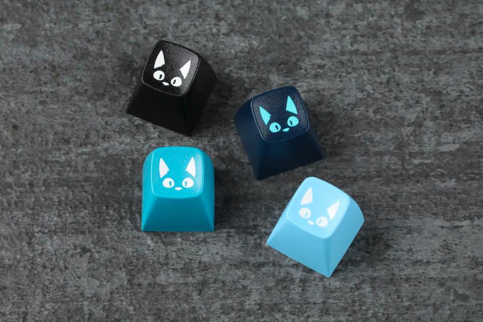 four cat themed keycaps